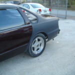 Before and after photographs of a damaged Chevy Impala that was repaired by Elite Paint & Body Shop in West Palm Beach, Florida.